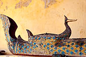 Vientiane, Laos - Wat Si Saket, the wooden trough in the shape of a Naga, used for the  ceremonial cleaning of Buddha statue.